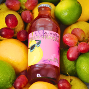 Bottle of Ev's Eclectics Pear-vençal on top of fruit